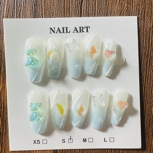 Elegant White Nail Art Set with Colorful Accents